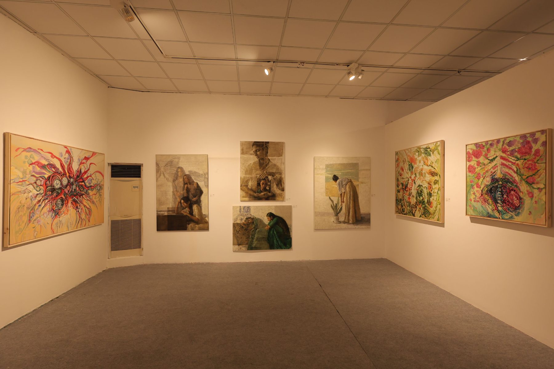 A room of florals and quiet figurative canvases